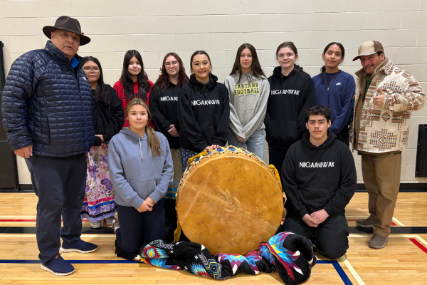 Students and Elders posing with the new Powwow Drum.